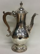 A large Georgian silver coffee pot with central armorial. London 1780. By Charles Wright.