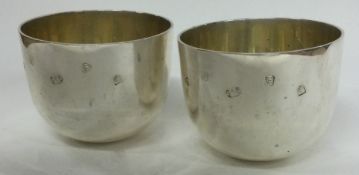 A pair of silver Britannia Jubilee tumbler cups.