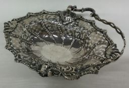 A good Georgian silver pierced basket on scroll feet.