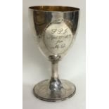 A heavy Georgian silver goblet engraved with flowers. Incuse mark. London 1785.