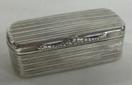 A George III reeded silver snuff box. London 1824. By Charles Rawlings.