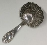 A Silver caddy spoon. Sheffield 1906. By W&H.