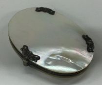 An early 19th Century silver and MOP magnifying glass.