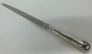 A silver handled letter opener. London 1994.