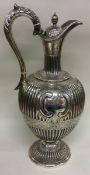 A Victorian silver wine jug with fluted border. Sheffield 1861. By Martin Hall & Co.
