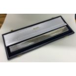 A cased Britannia Standard silver ruler depicting 'Rulers of Britain'. London 2001.