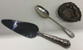 A silver Kings' pattern cake slice together with a spoons etc.