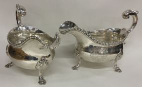 A good heavy pair of Georgian silver sauce boats with central armorials. London 1767.