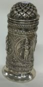 A Thai silver caster with embossed decoration.