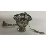 A Continental silver basket with suspension chains.