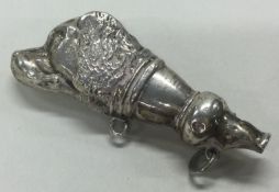 A silver dog whistle. Birmingham 1907. By Crisford & Norris Ltd.