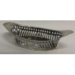 A small oval silver sweet dish.