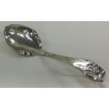 A Danish silver caddy spoon with hammered decoration.