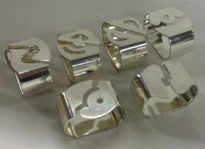 A set of six German silver plated menu holders.