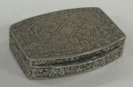 An engraved Continental silver hinged pill box. Marked to interior.