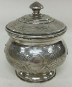 A Russian silver biscuit box. Marked to base.