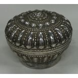 A chased Turkish silver box with lift-off lid.