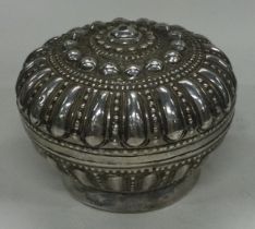 A chased Turkish silver box with lift-off lid.