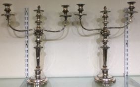 A good pair of Sheffield silver plated candelabras with removable tops.