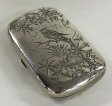 A Victorian silver Aesthetic Movement cigarette case engraved with owls and other birds.