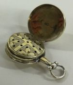 A William IV silver gilt vinaigrette in the form of a pocket watch with floral grill. 1810.