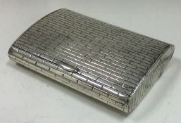 A silver box engraved with brickwork pattern. London 1962. By SJR.