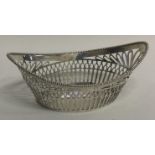 An oval pierced silver basket.