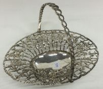 A Georgian silver swing handled basket with pierced decoration. London 1767.