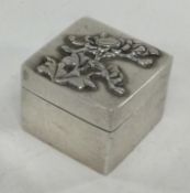 A Chinese silver stamp case with embossed decoration. By LH.