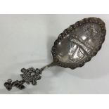 A pierced silver caddy spoon. By Amy Sandheim.