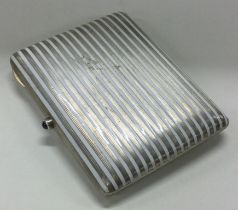 A silver and white enamelled cigarette case. Marked to interior.