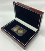 A cased 1887 George III gold shield back Guinea coin.