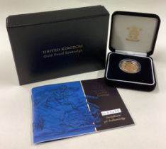 A cased 2001 gold Proof Full Sovereign coin.