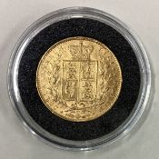An 1864 gold shield back Full Sovereign coin.