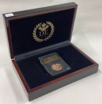 A cased 2021 gold Full Sovereign coin.