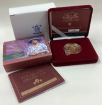 A good cased "The Queen Mother Centenary Year" gold Crown coin.