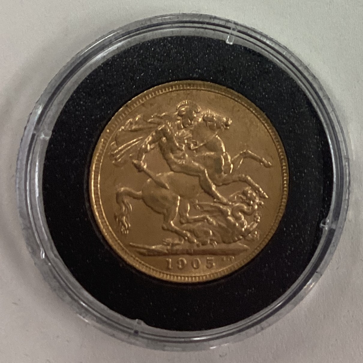 A 1905 gold Full Sovereign coin.