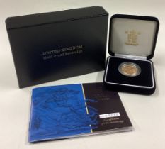 A cased 2001 gold Proof Full Sovereign coin.