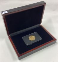 A cased heavy early gold shield back coin.