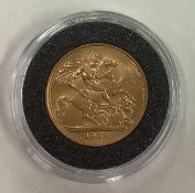 A 1958 gold Full Sovereign coin.