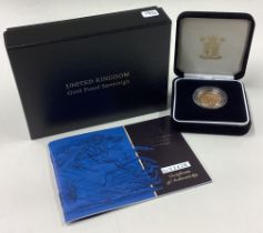 A cased 2001 gold Proof Full Sovereign coin.