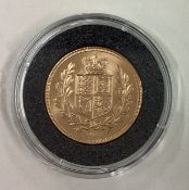 A 2002 gold shield back Full Sovereign coin.