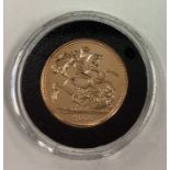 A 2006 gold Full Sovereign coin.