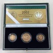 A cased 2002 gold three-coin Sovereign set.