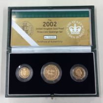 A cased 2002 gold three-coin Sovereign set.