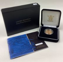 A cased 2001 gold Proof Full Sovereign coin.