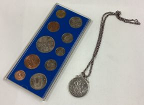 An 1893 Crown coin on chain together with a cased specimen coin set.