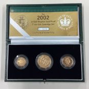 A cased 2002 gold three-coin Sovereign set.