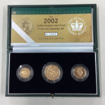 A cased 2002 gold three-coin Sovereign set.