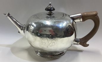 A fine quality George II silver bullet shaped teapot with crested sides. London 1728.